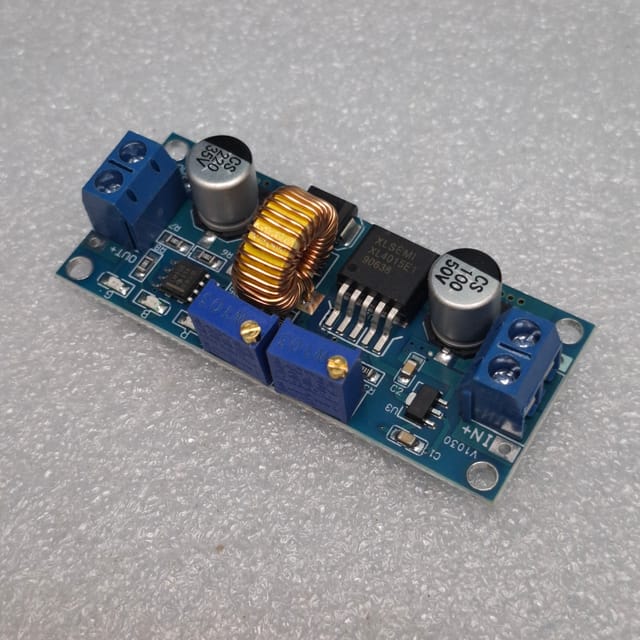 XL4015 DC-DC step-down buck converter module. This type of module is used to convert a higher DC voltage to a lower, adjustable DC voltage._img_3