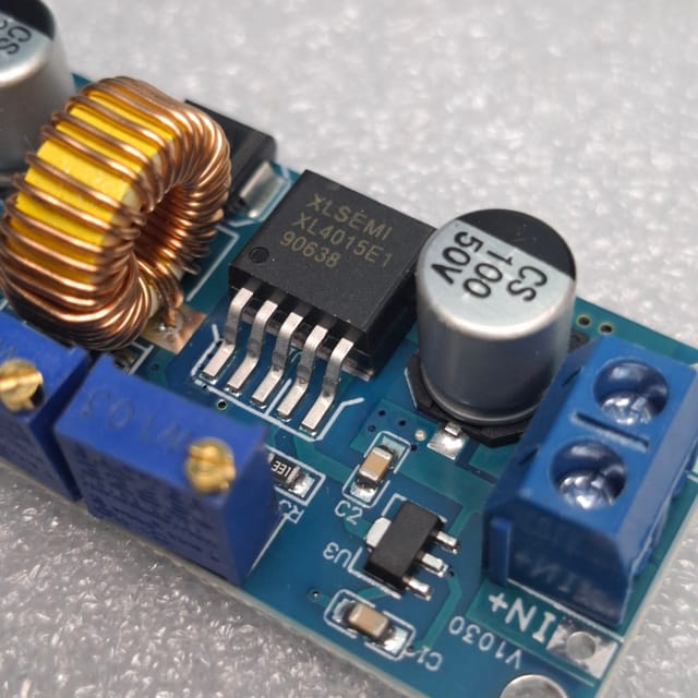 XL4015 DC-DC step-down buck converter module. This type of module is used to convert a higher DC voltage to a lower, adjustable DC voltage._img_4
